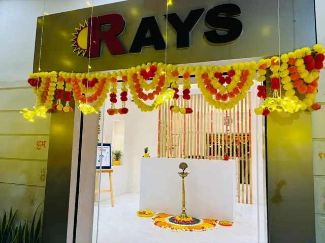 Rays EdTech entrance decorated with marigold garlands for a traditional opening ceremony